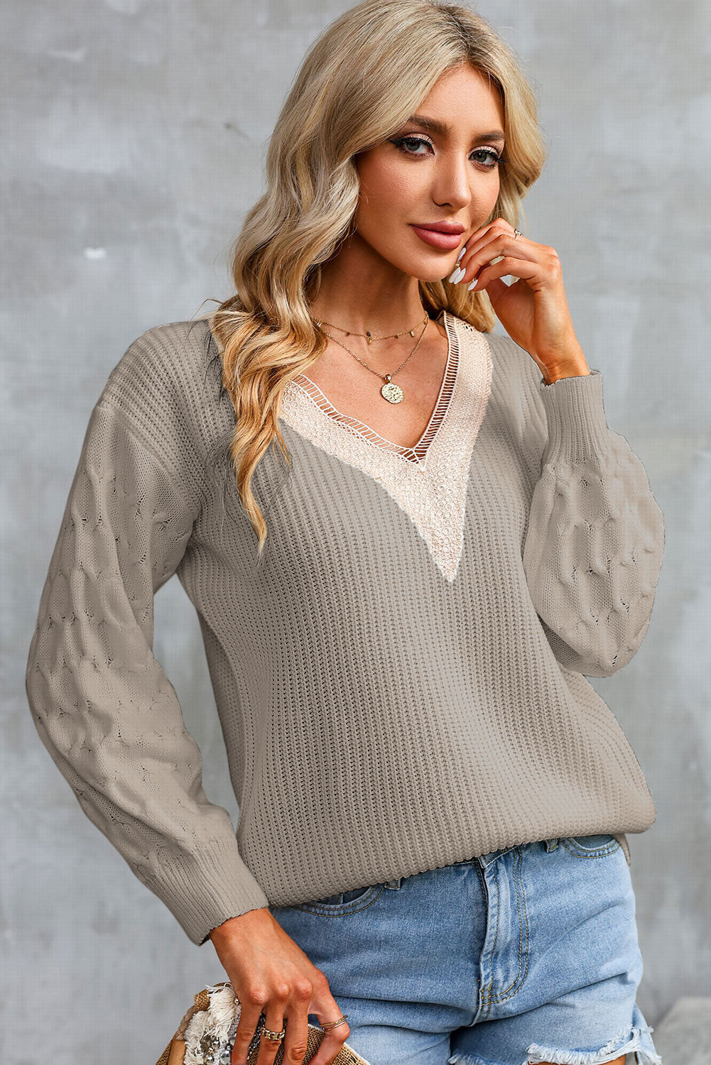 Khaki V-neck sweater with cream contrast V-neck and long sleeves, ribbed cuffs