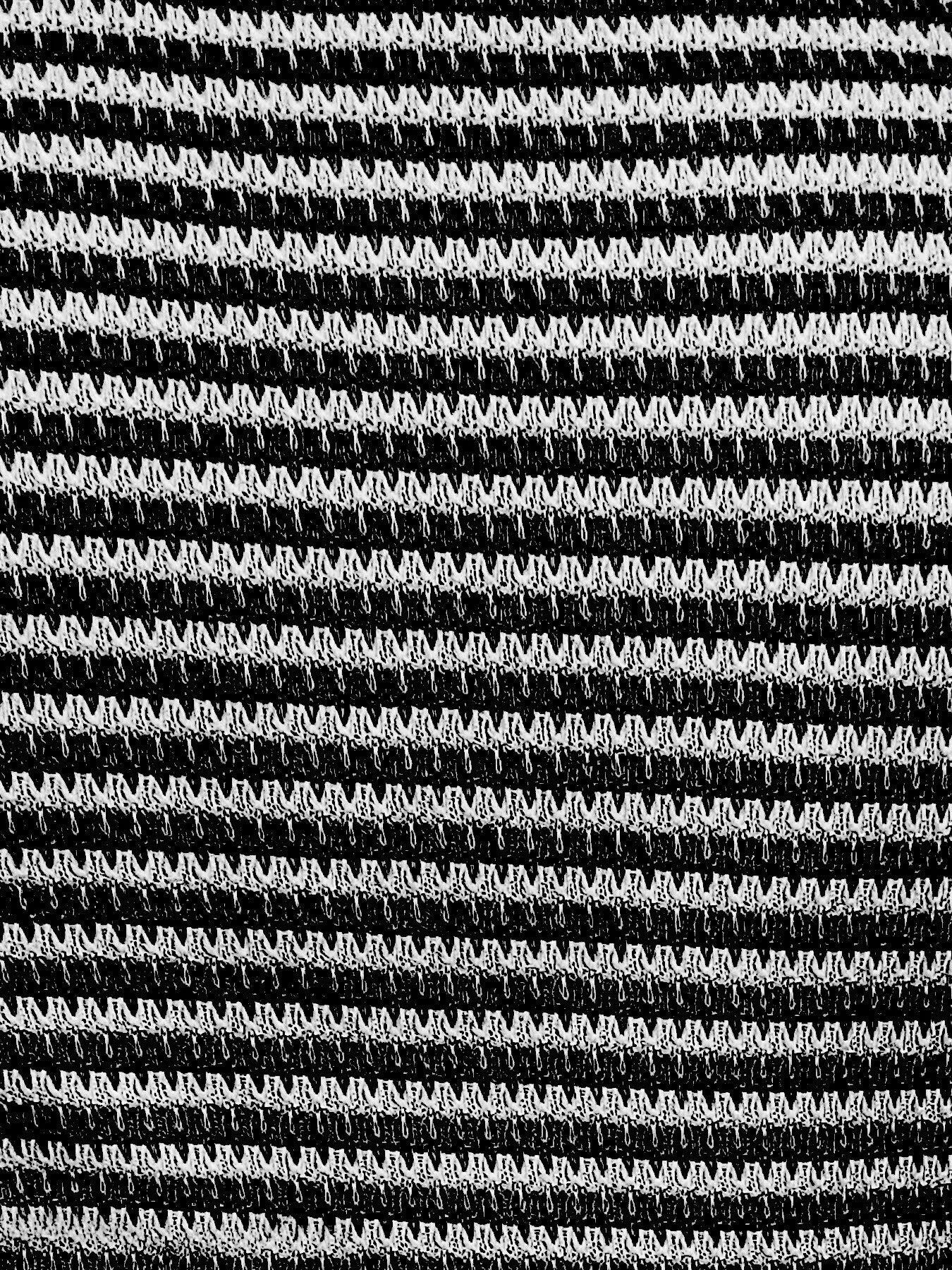 Close-up of striped knit button-front tank top in dark and white tones