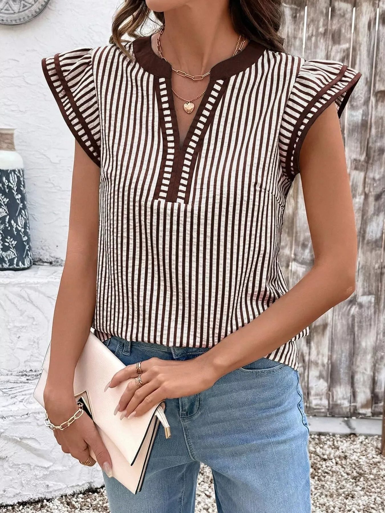 Striped ruffle-sleeve blouse in brown and white with V-neck trim