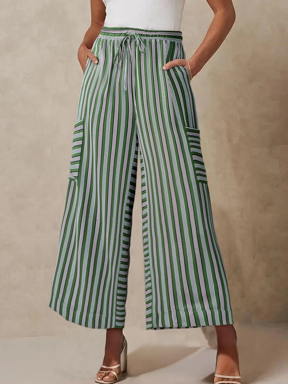 White and dark green striped wide-leg pants with elastic waist and patch pockets