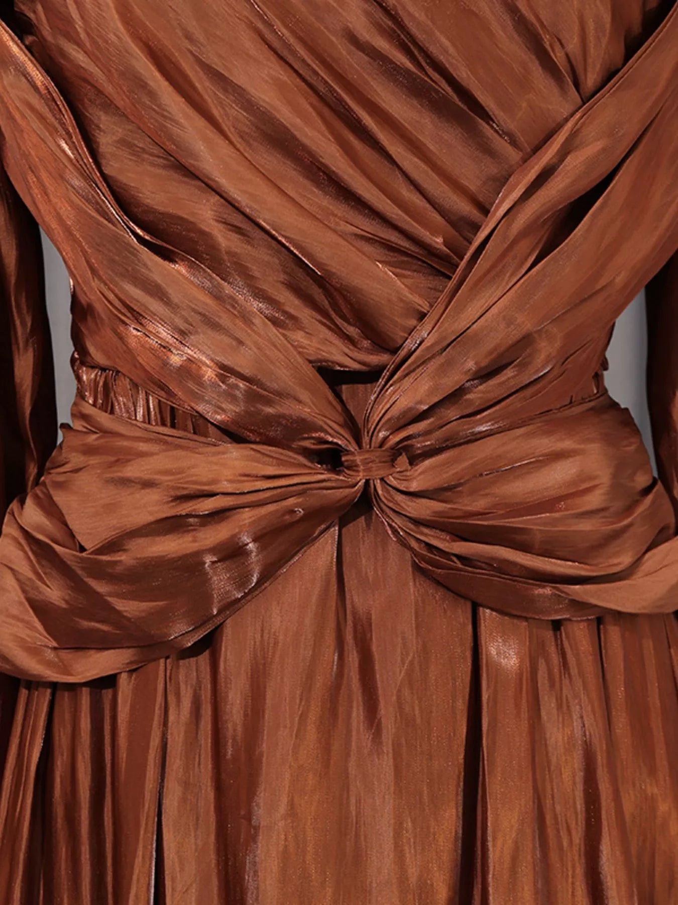 Cedar & Moore Front Twisted Draped Long Sleeve Maxi Dress in copper-brown satin with ruched front and knotted waist.