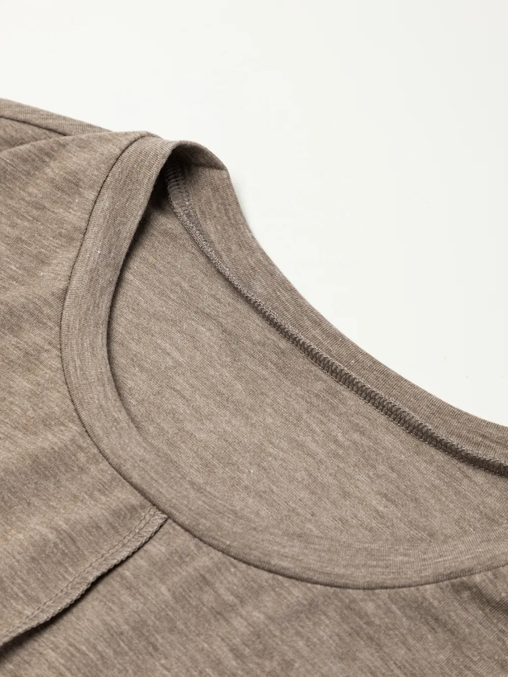 Mocha round neckline detail with exposed seam and short sleeves