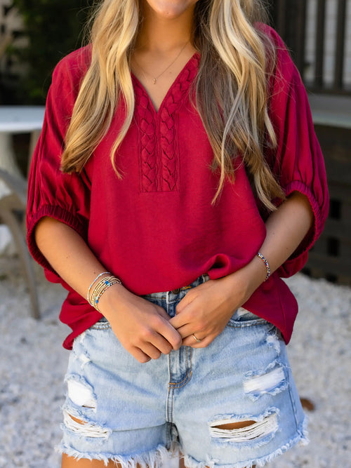Deep red braided detail half-sleeve blouse with V-neck and gathered neckline