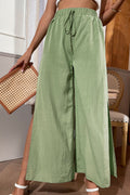 Green wide-leg pants with drawstring waist and side slit seam