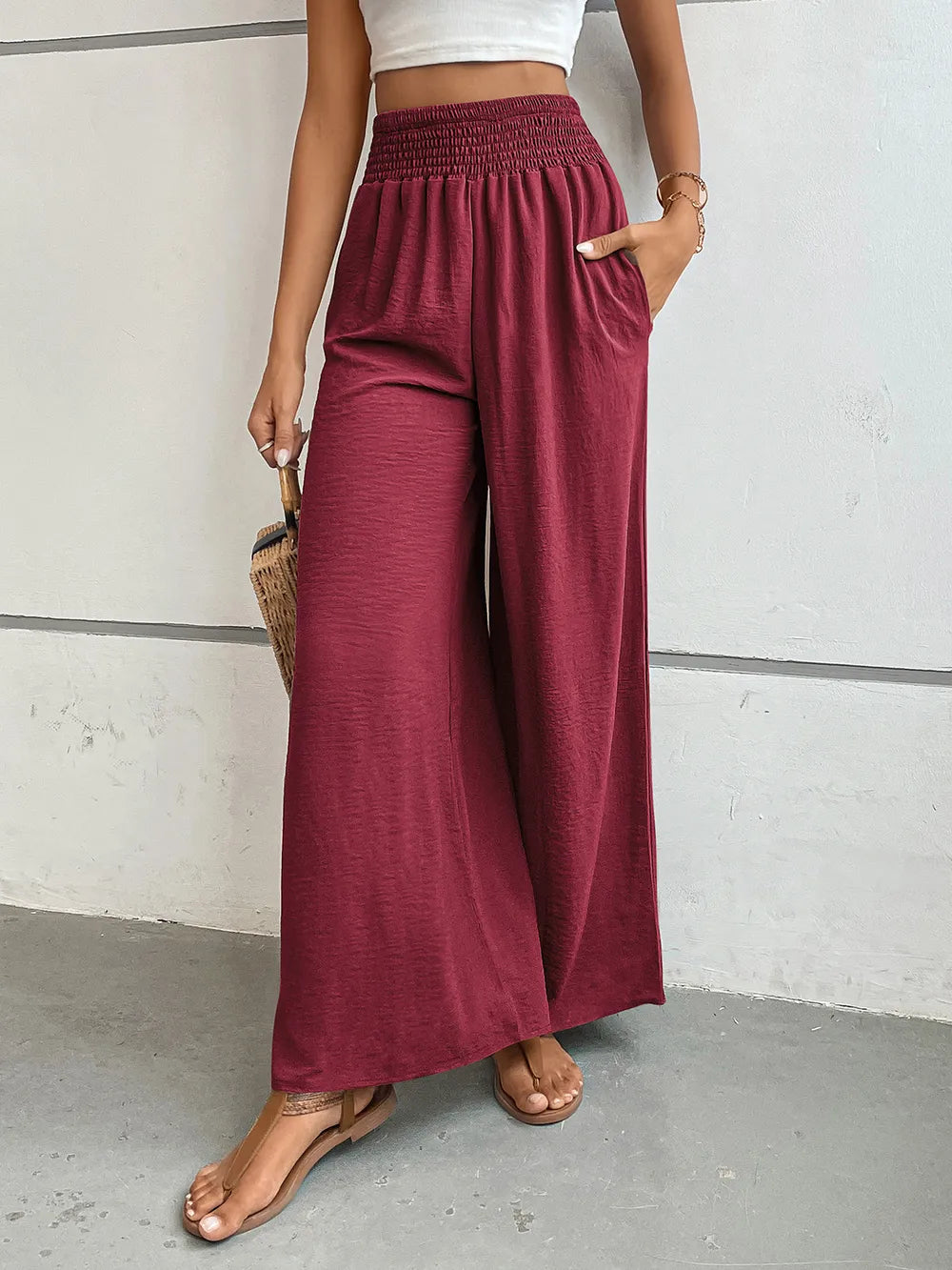 Wide-leg pants in burgundy with elastic waistband and side pockets