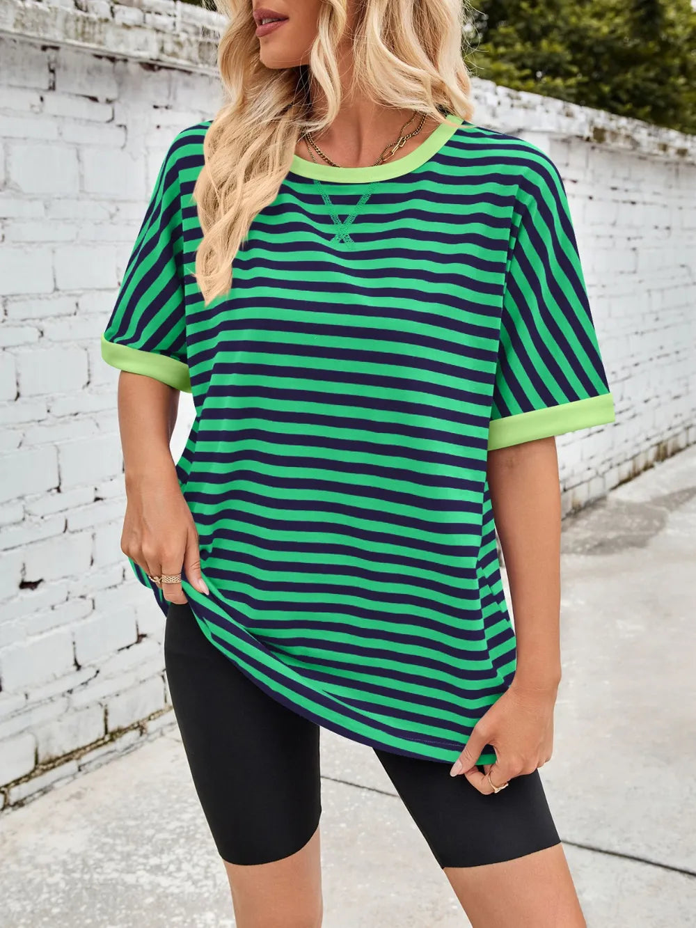 Green striped round-neck half-sleeve T-shirt with ribbed neckline and curved hem