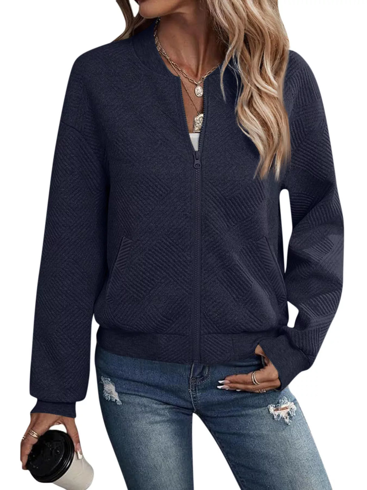 Navy textured knit zip-up jacket with pockets, front zipper, and long sleeves