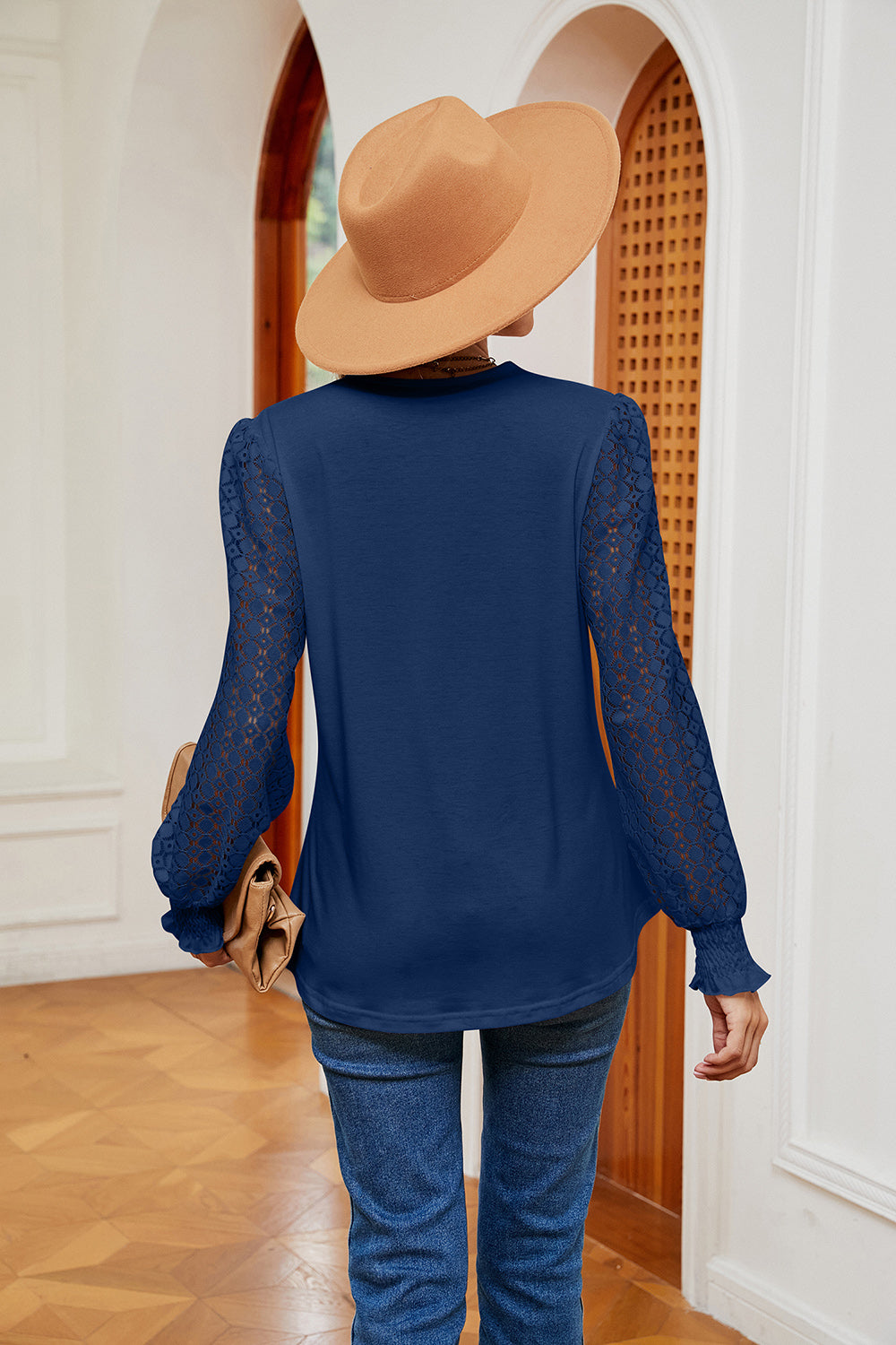 Navy contrast V-neck blouse, back view, with sheer patterned long sleeves