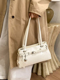 White vegan leather shoulder bag with star buckle detail and top handles