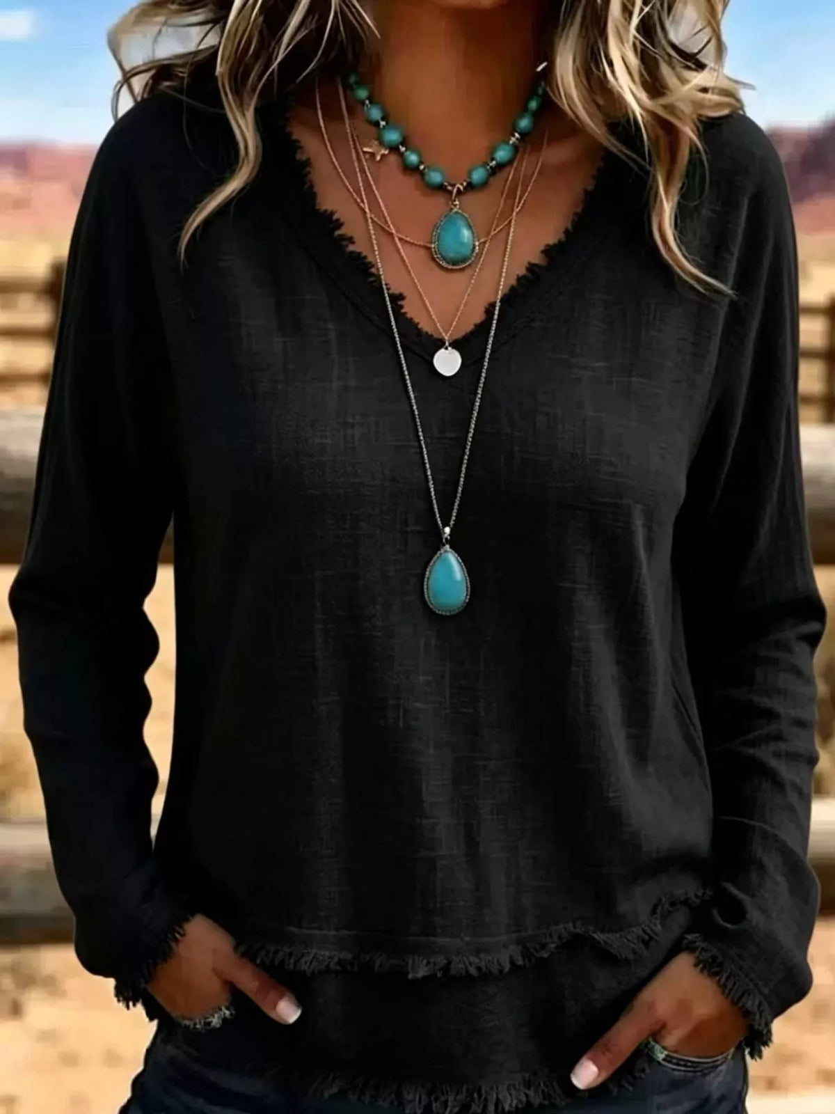 Black frayed-hem V-neck relaxed-fit blouse, long sleeves