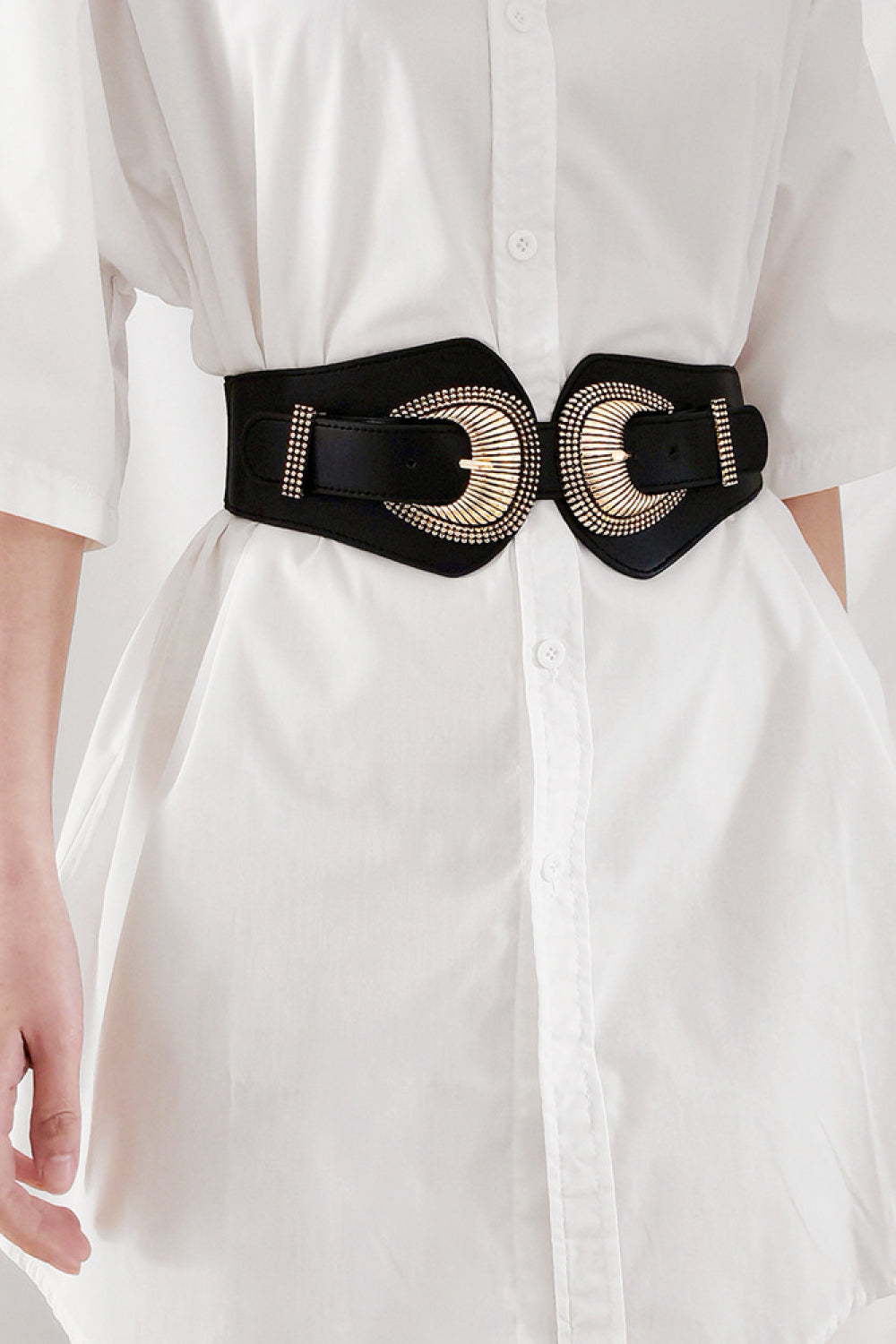 Black elastic wide belt with double shell-style buckle and gold-tone ring hardware