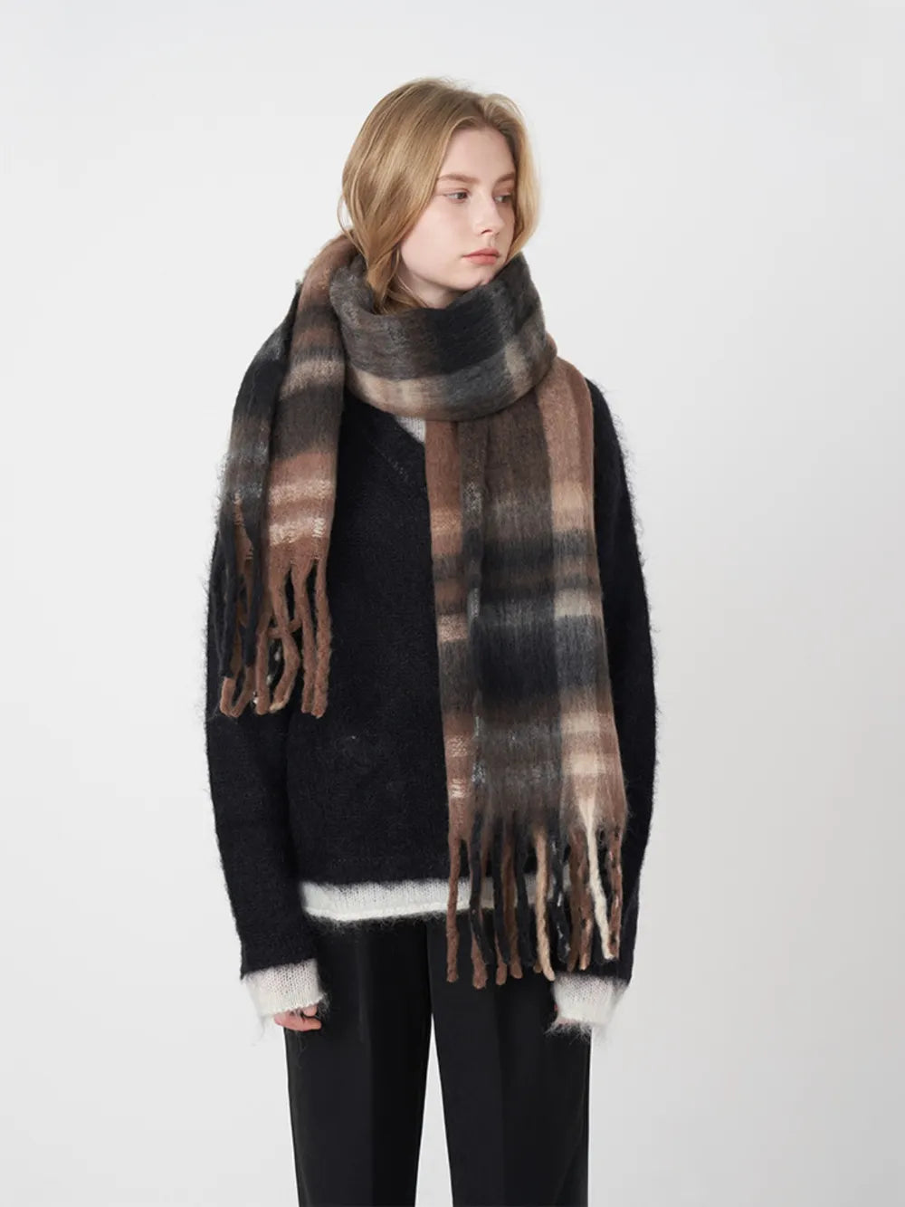 Plaid polyester scarf in dark gray, black, and brown tones with long fringe