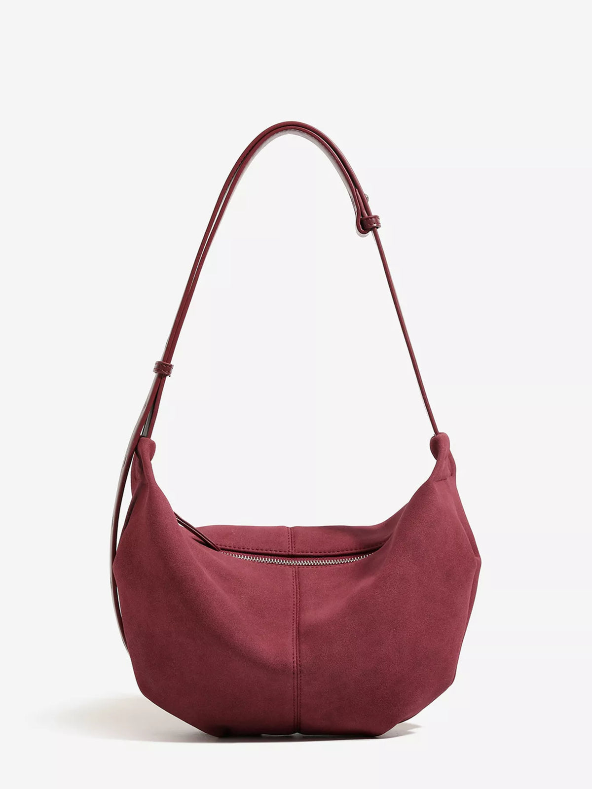 Wine red suede crescent shoulder bag with adjustable strap and front zipper detail