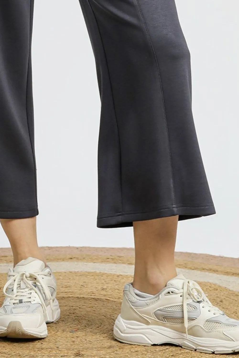 Dark gray wide-leg cropped pants with straight hems and ankle-length drape