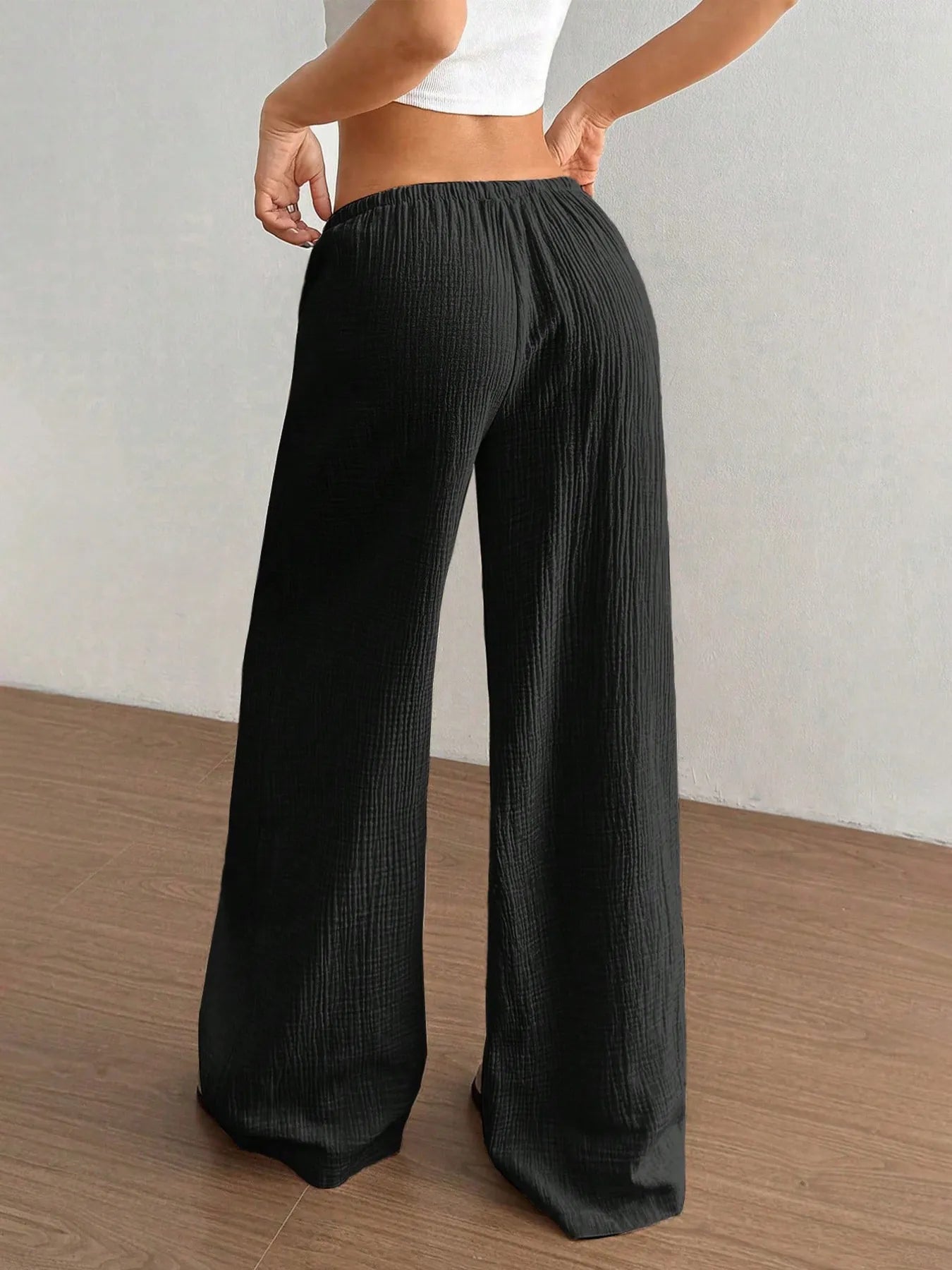 Black wide-leg drawstring pants, relaxed fit with gathered elastic waistband