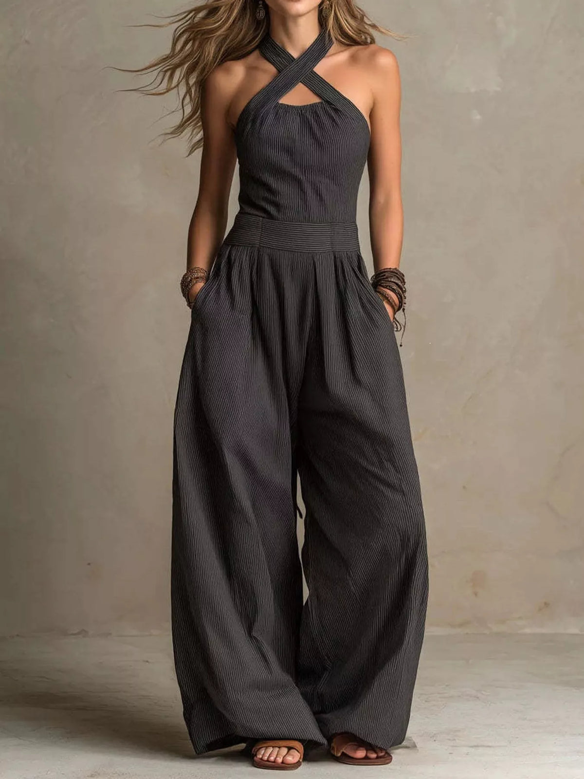 Charcoal halter linen jumpsuit with gathered bodice and wide-leg silhouette