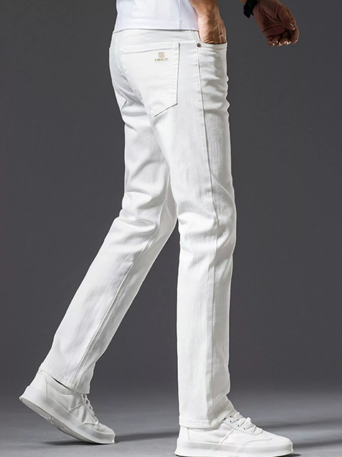 White slim-fit stretch cotton jeans with back yoke, rear pockets, and belt loops