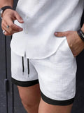 Men's drawstring textured shorts, white with black trim and side slit