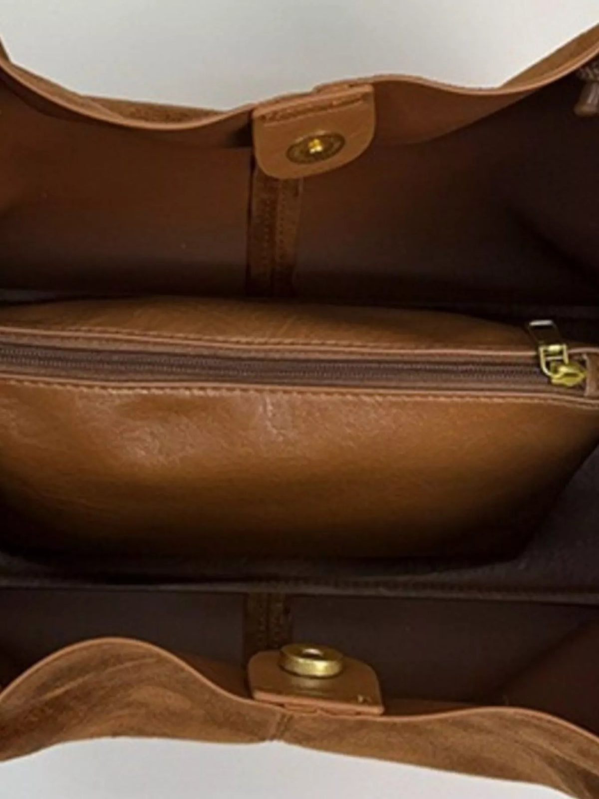 Brown suede tote bag interior with top compartment and gold-toned hardware