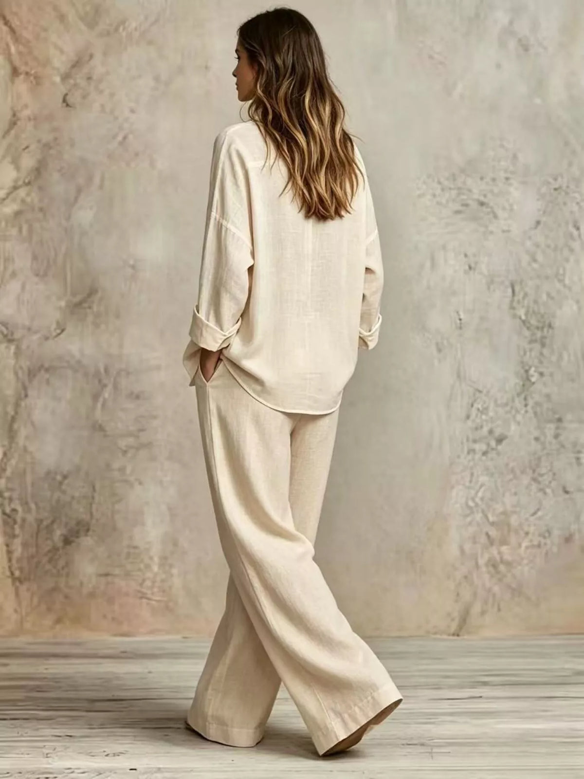 Beige wide-leg button shirt and pants set, back view, cuffed sleeves, button detail.