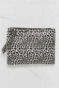 Leopard-print zip wristlet pouch with wrist strap, white fabric with brown spots