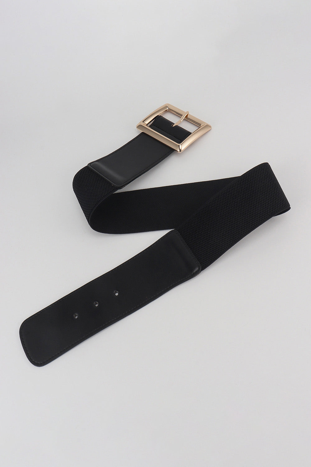 Black wide elastic belt with rectangle gold buckle, strap laid in loop.