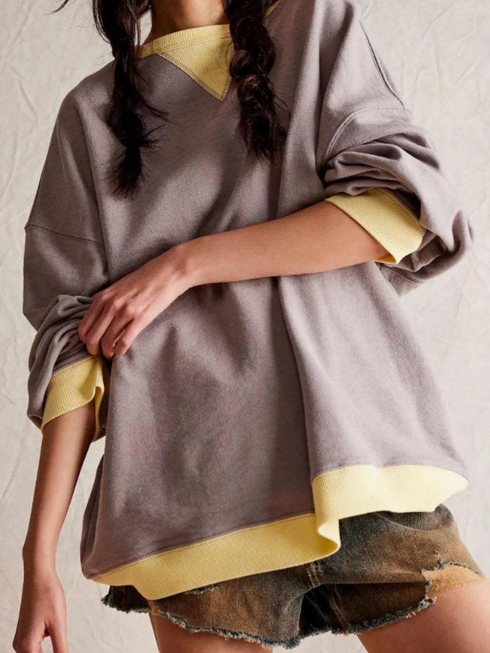 Gray long-sleeve sweatshirt with yellow contrast V neckline and yellow-trim hem