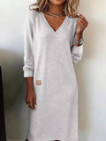 Light gray V-neck long-sleeve midi dress with small square chest patch