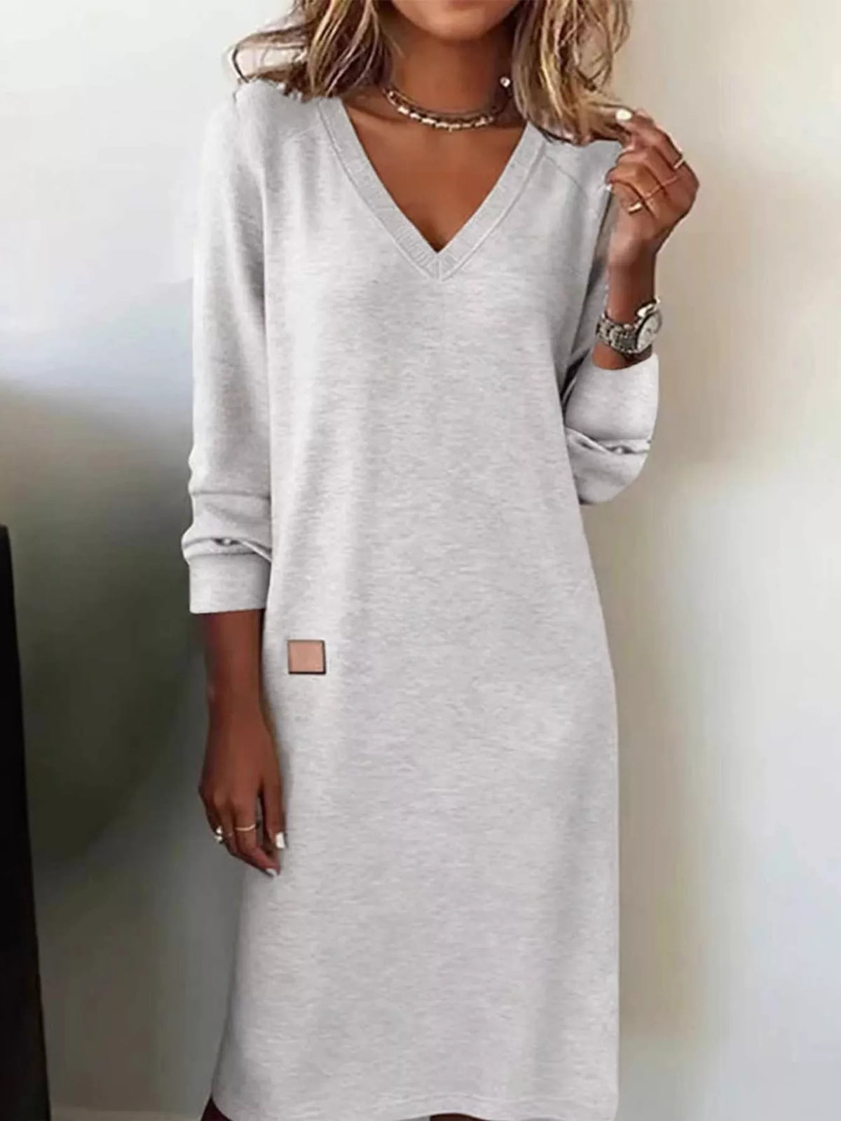 Light gray V-neck long-sleeve midi dress with small square chest patch