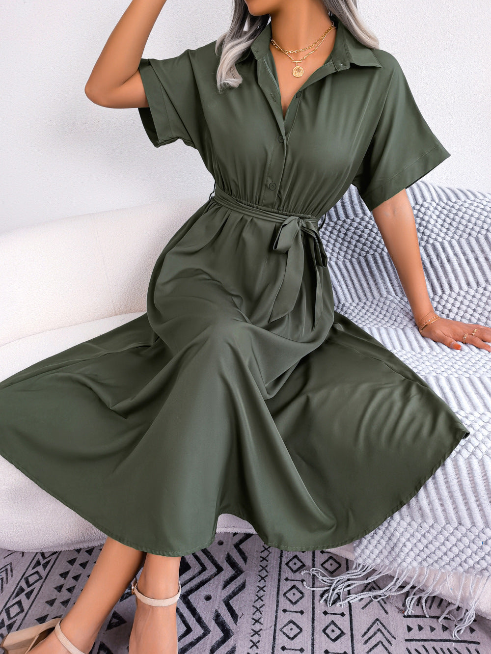 Army green short-sleeve collared tie belt dress with button front and gathered skirt