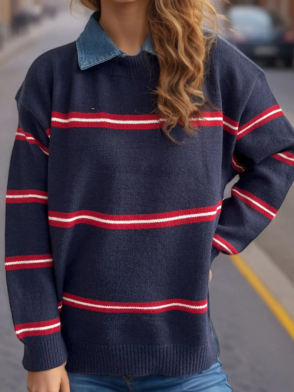 Dark blue round-neck long-sleeve sweater with red and white stripe bands at chest