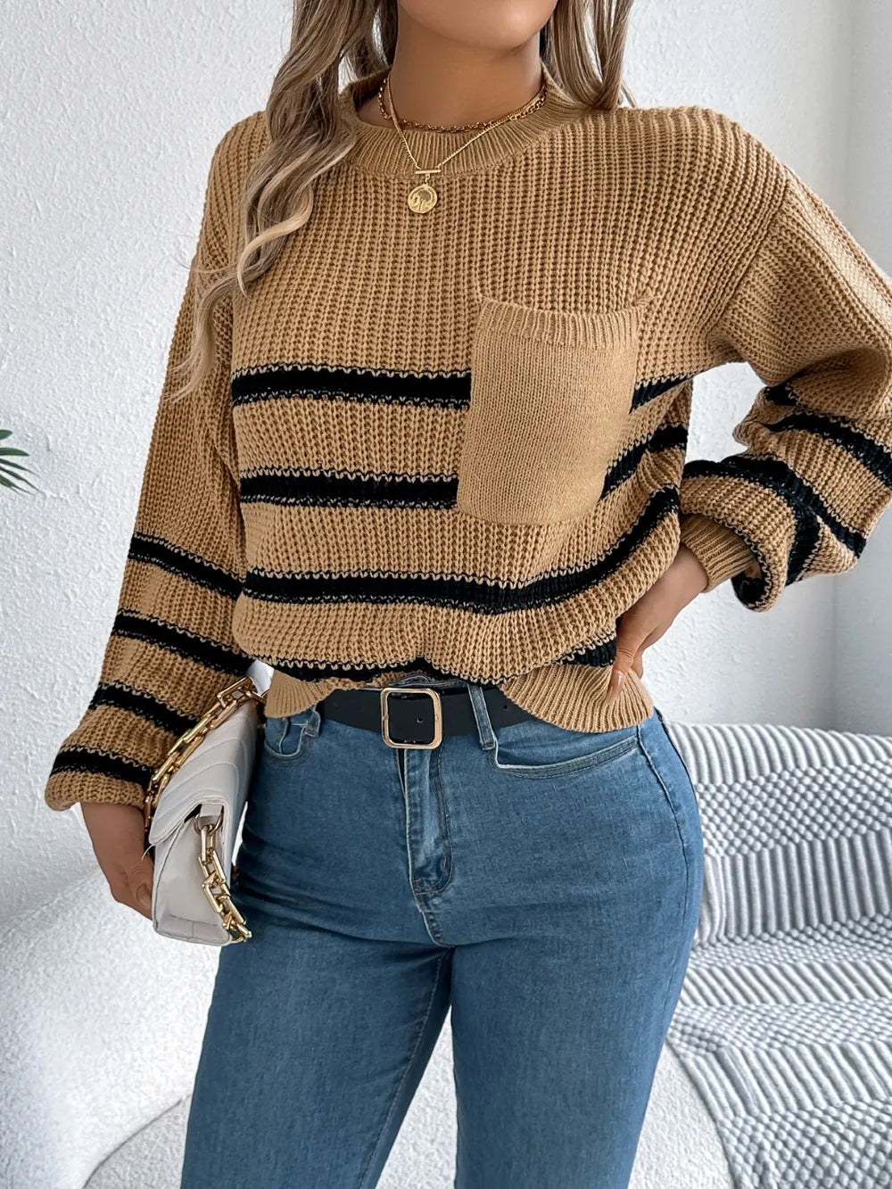 Caramel striped knit sweater with round neckline and long sleeves, chest pocket detail