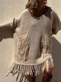 Camel long-sleeve sweater with fringe hem, knit pockets, and round neckline.