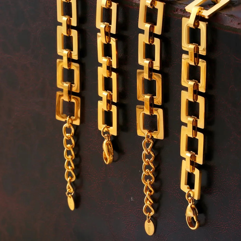 Gold hollow square link chain bracelets hanging in a row
