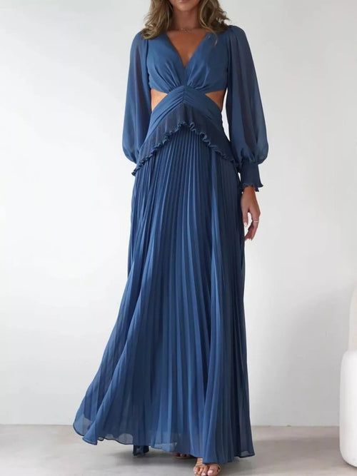 Blue backless pleated maxi dress with long sleeves and V neckline; tiered ruffle waist