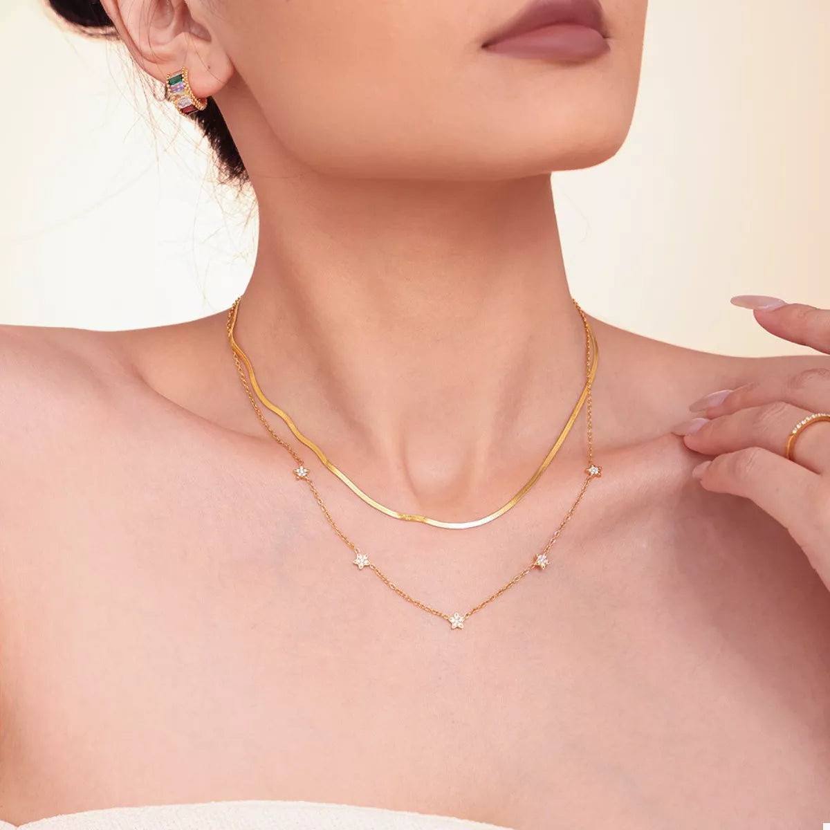 Gold-plated 2-piece necklace set with curved chain and small star zircon accents