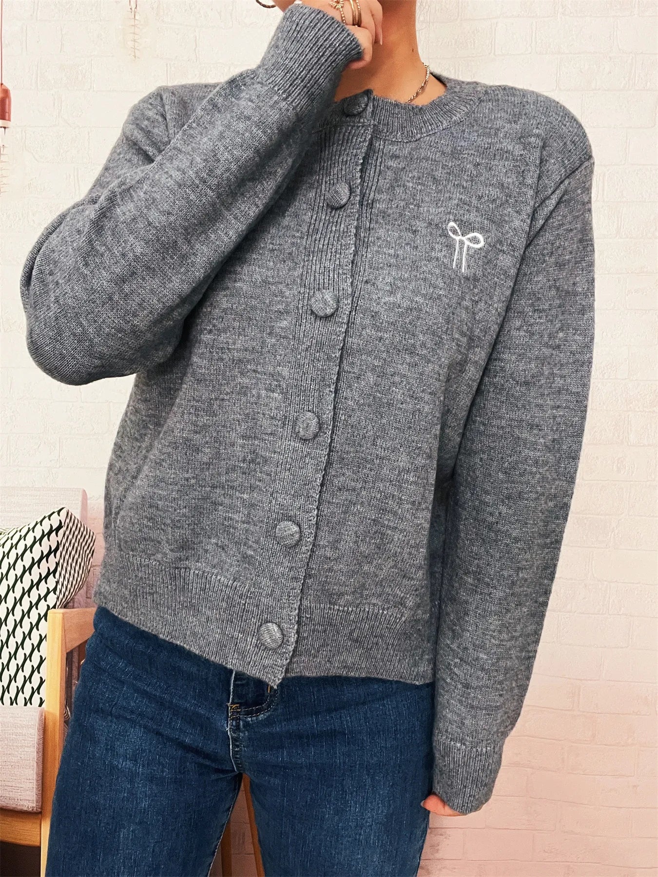 Heather gray button-up long sleeve cardigan with button front and textured knit.