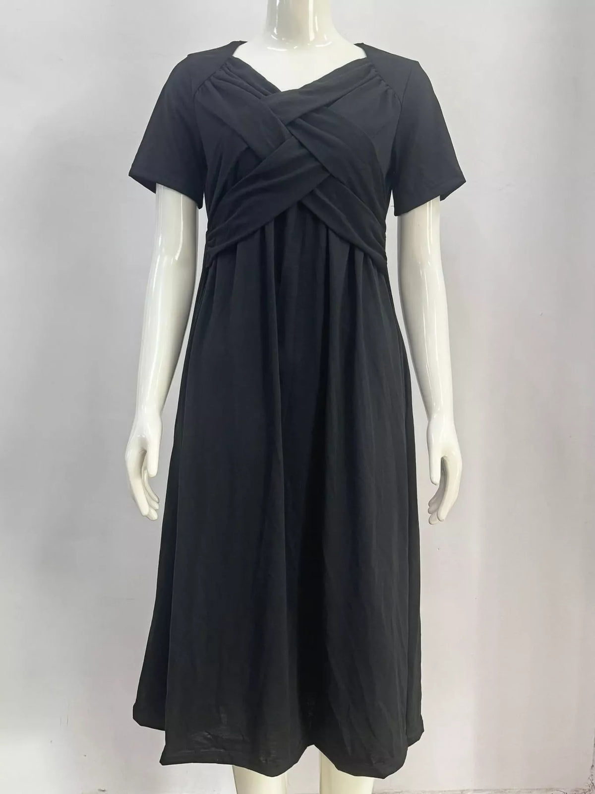 Dark navy midi dress with crisscross wrap bodice and short sleeves