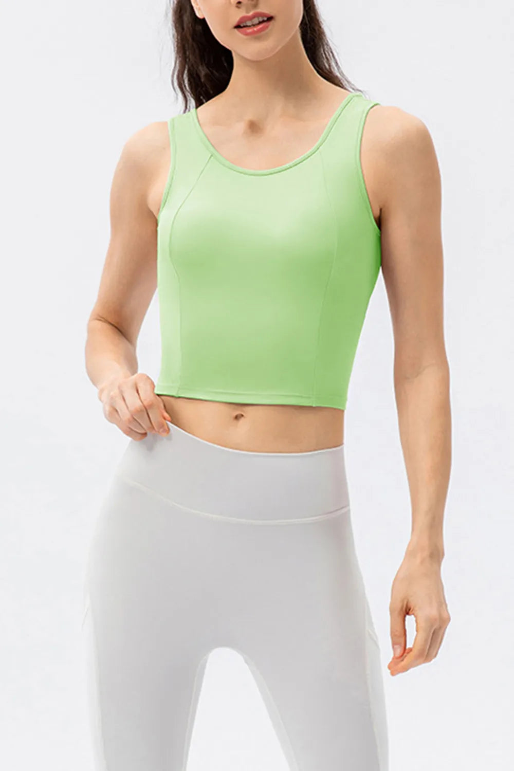 Green active tank top with wide straps and round neckline