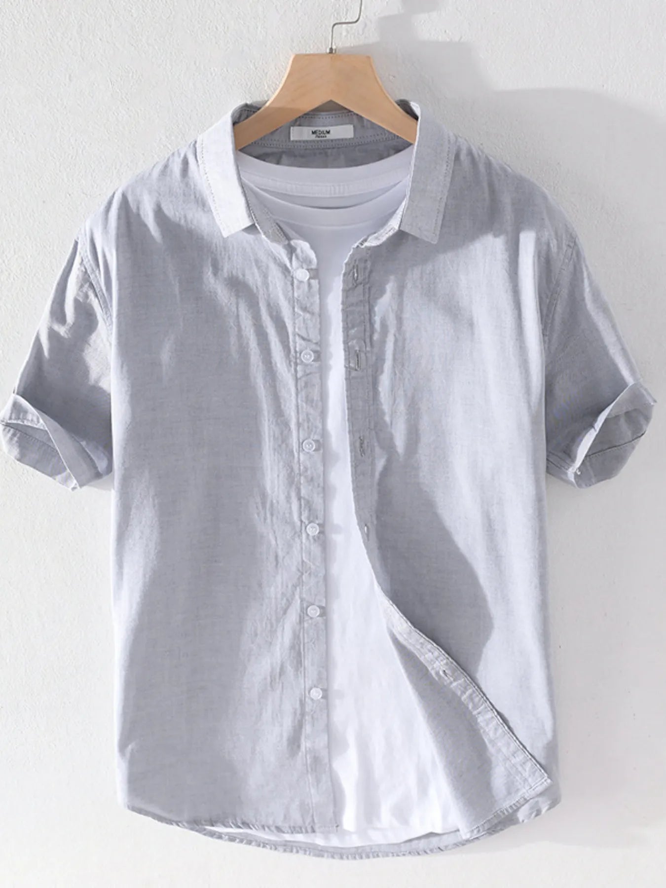 Men's short sleeve button-up shirt, light grey with front buttons and pointed collar