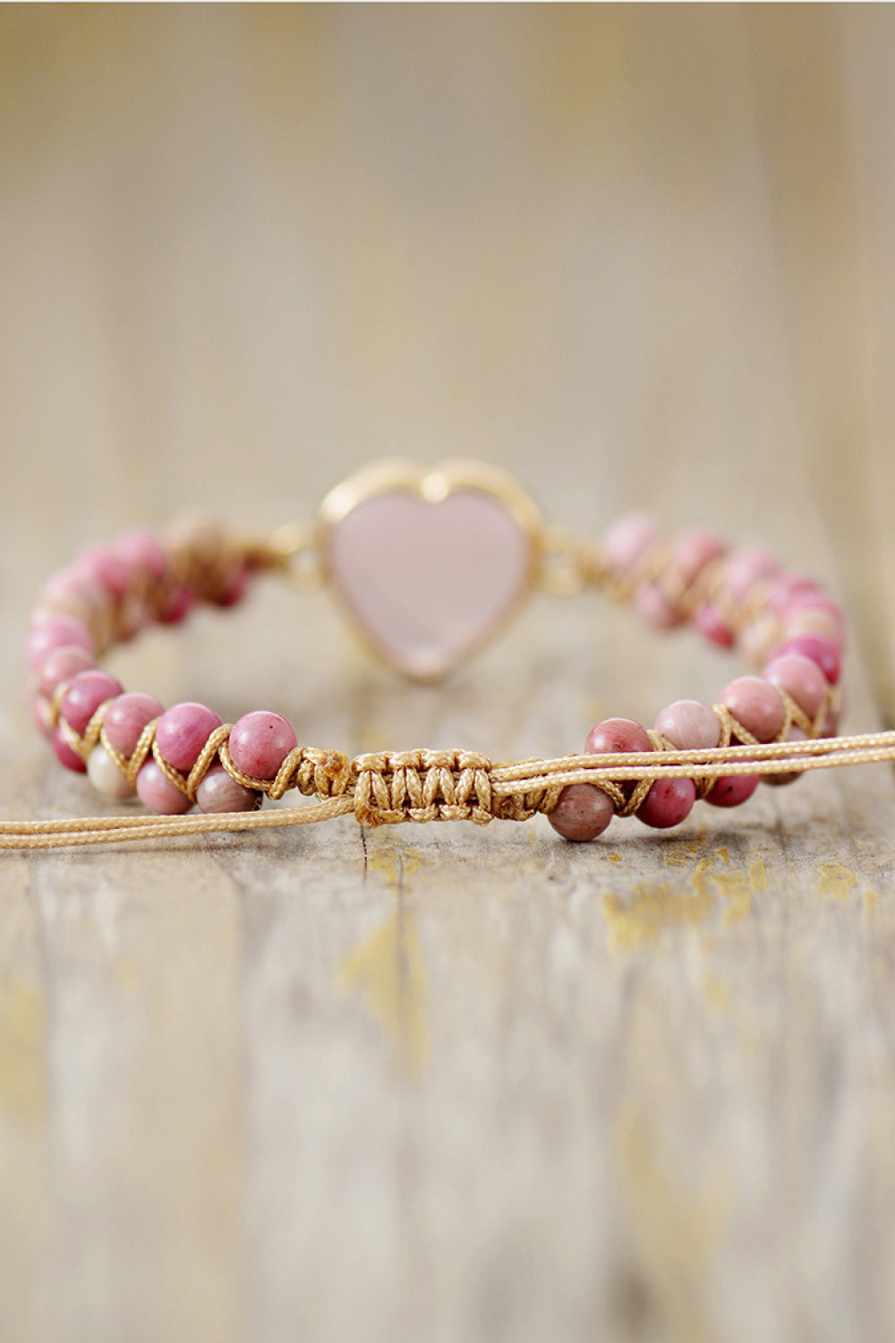 Dusty pink heart beaded bracelet with heart charm on braided cord