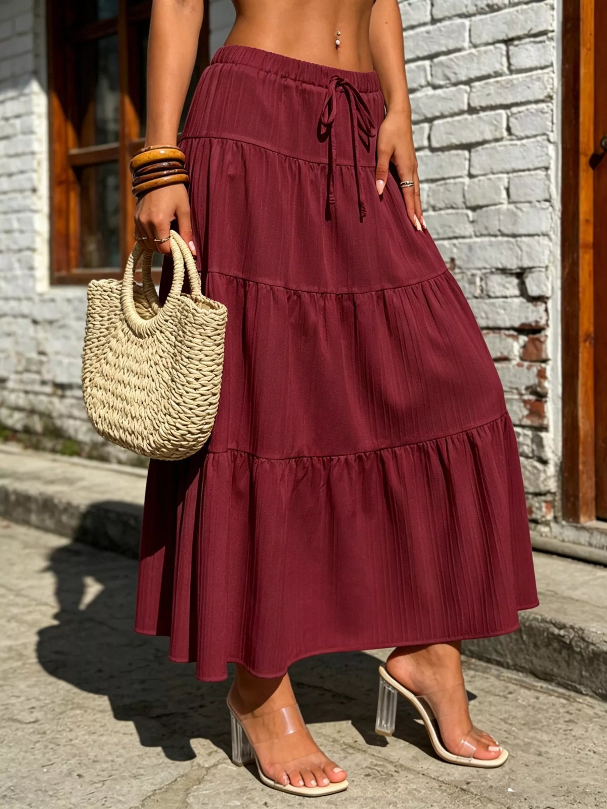 Burgundy tiered maxi skirt with ruched drawstring waist and tiered ruffles