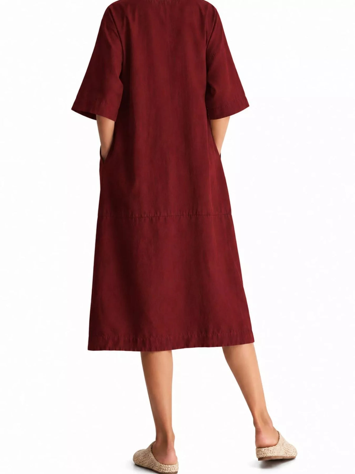 Back view of loose-fit burgundy linen-blend midi dress with short sleeves and pockets