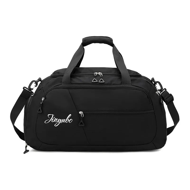 Large nylon travel duffel bag in black with zip front pocket, top handle, and side straps