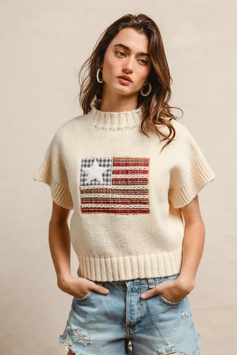 Oatmeal knit drop-shoulder sweater with short sleeves and American flag patch front