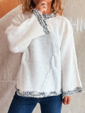White round-neck sweater with contrast knit trim at collar, cuffs, and hem