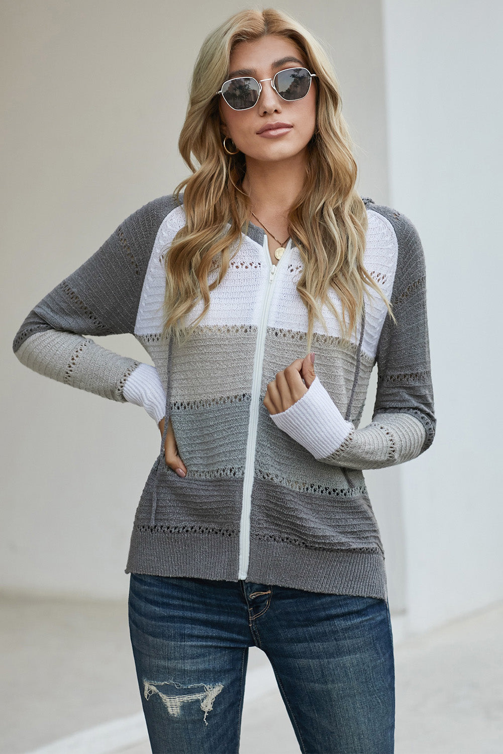 Gray zip-up hooded cardigan with openwork texture, white striped yoke and ribbed cuffs
