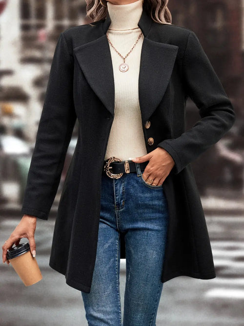 Black button-up longline coat with notch lapels and chest flap pockets