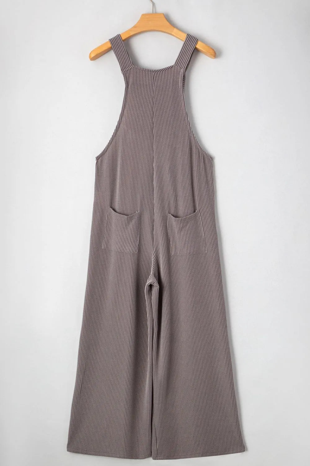 Wide-leg overalls on hanger with adjustable straps, dark pinstripe, front pockets