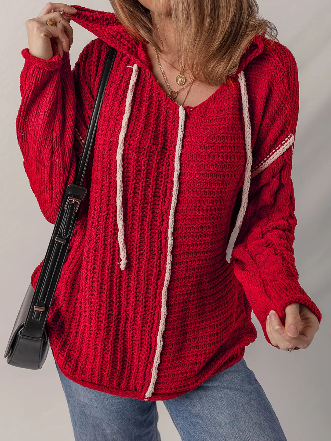 Deep red textured knit hooded sweater with contrast white trim and drawstring